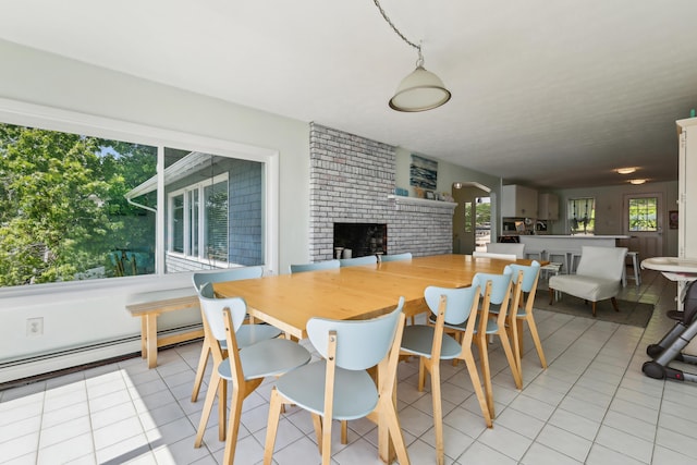 57 Oak St, Wareham, MA 02571 - dining space featuring light tile patterned floors, a fireplace, and baseboard heating