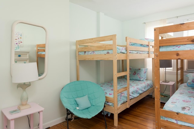 bedroom with wood-type flooring