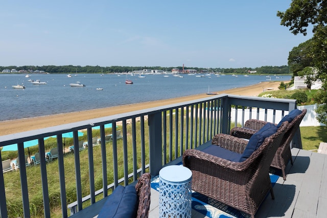 balcony featuring a water view