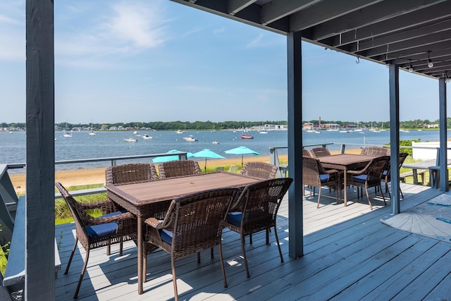 wooden deck with a water view