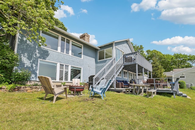 57 Oak St, Wareham, MA 02571 - back of property featuring a wooden deck, a chimney, a yard, and stairway