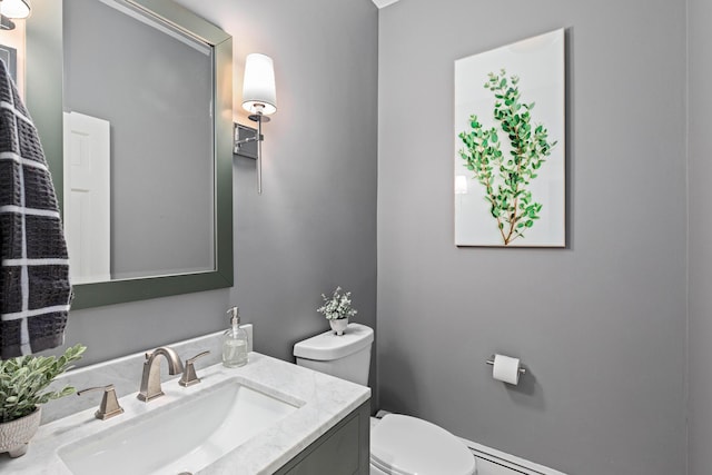 half bathroom featuring toilet and vanity