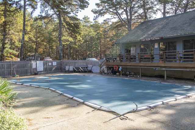 view of swimming pool featuring a deck