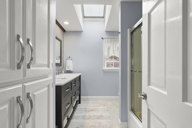 5 Lancaster Ln, Bourne, MA 02532 - full bath with double vanity, baseboards, and recessed lighting