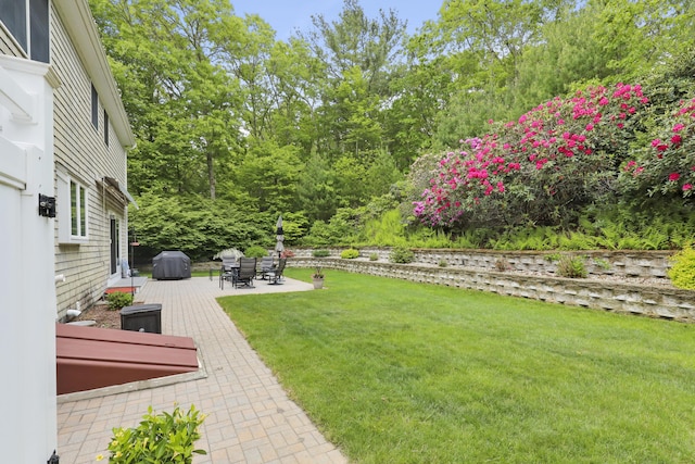 5 Lancaster Ln, Bourne, MA 02532 - view of grassy yard with a patio area