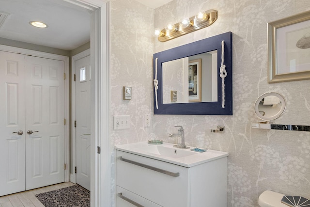 544 Shore Rd Unit 9, Truro, MA 02666 - bathroom featuring vanity, toilet, a closet, wood finished floors, and recessed lighting