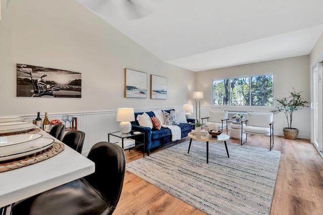 81 Fletcher Ln Unit C, Brewster, MA 02631 - living area with light wood-type flooring, lofted ceiling, a wainscoted wall, and ceiling fan