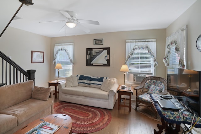 living room with hardwood / wood-style flooring and ceiling fan