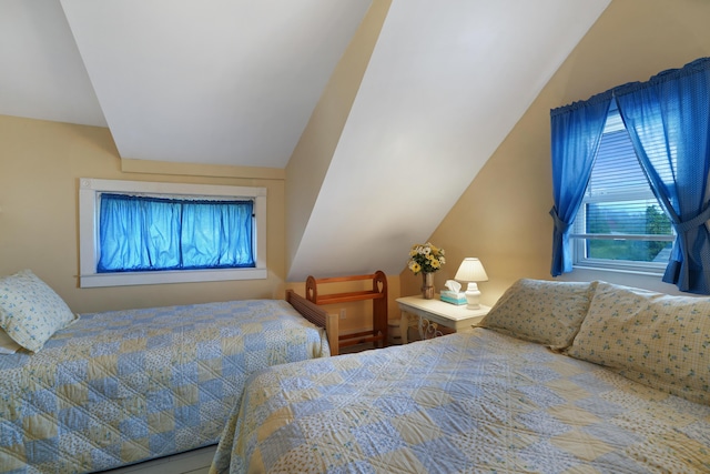 bedroom featuring lofted ceiling