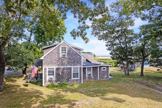 view of home's exterior with a lawn