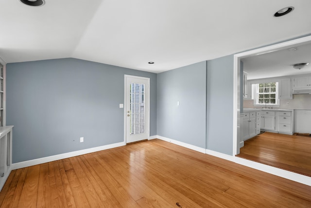 56 Wharf Ln, Yarmouth Port, MA 02675 - unfurnished room featuring light wood-style flooring and lofted ceiling