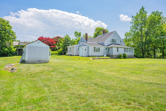 56 Wharf Ln, Yarmouth Port, MA 02675 - view of grassy yard with a storage unit