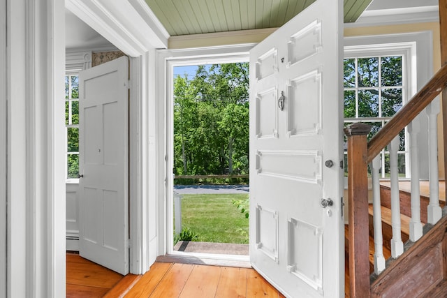 56 Wharf Ln, Yarmouth Port, MA 02675 - foyer featuring light wood-style floors, stairs, and a baseboard radiator
