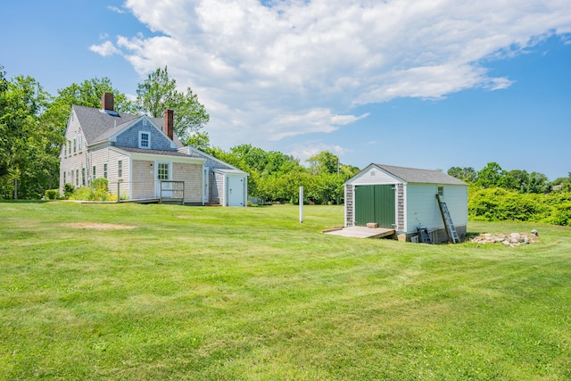 56 Wharf Ln, Yarmouth Port, MA 02675 - view of grassy yard with a storage shed