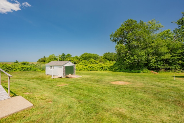 56 Wharf Ln, Yarmouth Port, MA 02675 - view of grassy yard featuring a storage shed