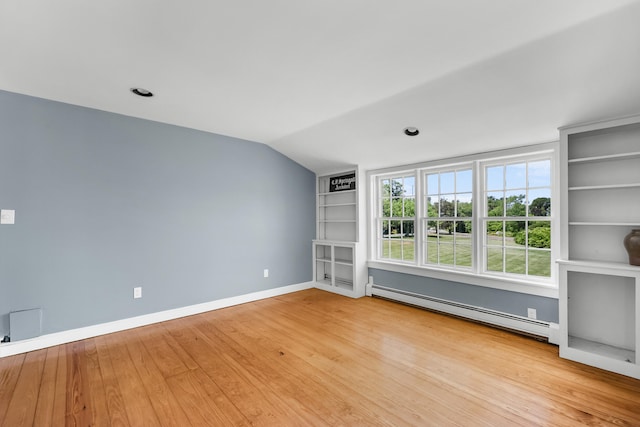 56 Wharf Ln, Yarmouth Port, MA 02675 - unfurnished room with baseboard heating, built in features, wood finished floors, and lofted ceiling