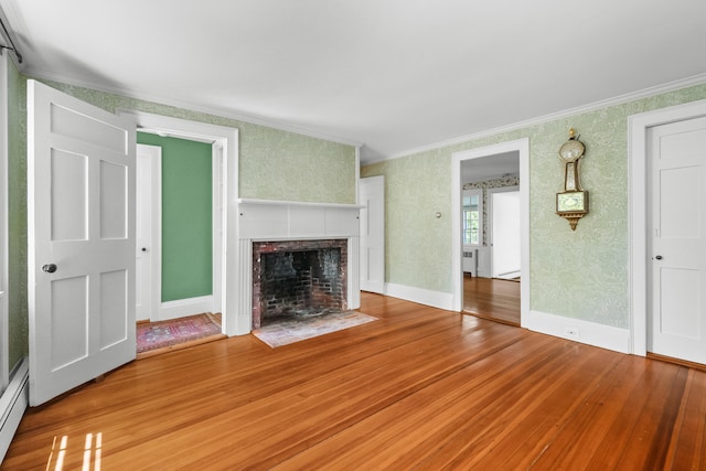 56 Wharf Ln, Yarmouth Port, MA 02675 - unfurnished living room with ornamental molding, wood finished floors, wallpapered walls, and a fireplace