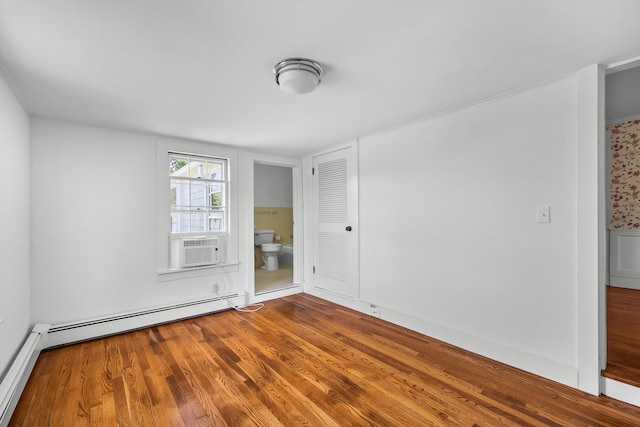 56 Wharf Ln, Yarmouth Port, MA 02675 - unfurnished room with wood finished floors and a baseboard radiator