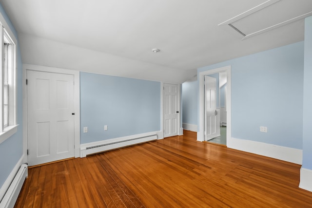 56 Wharf Ln, Yarmouth Port, MA 02675 - spare room with baseboard heating, lofted ceiling, and wood finished floors
