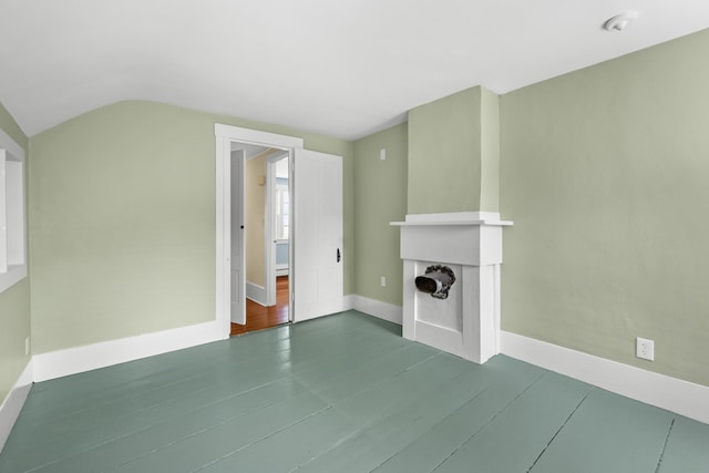 56 Wharf Ln, Yarmouth Port, MA 02675 - unfurnished living room with lofted ceiling and a fireplace