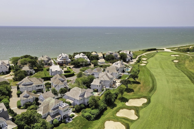 bird's eye view featuring a residential view, golf course view, and a water view