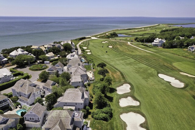 aerial view featuring view of golf course and a water view
