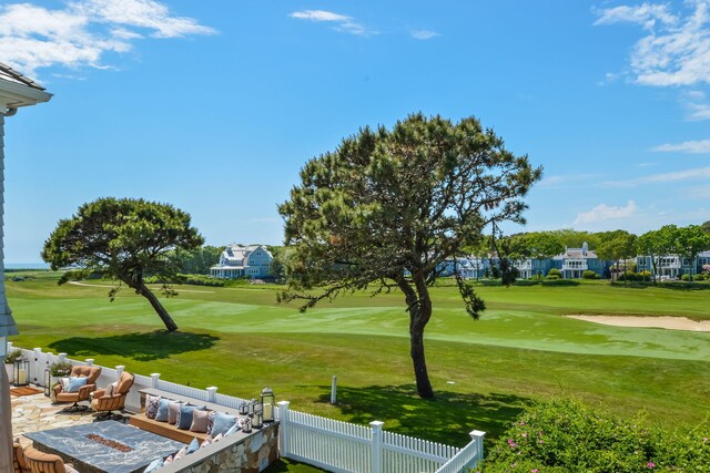 exterior space featuring golf course view and fence