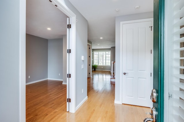 entrance foyer with light wood finished floors, baseboards, and recessed lighting