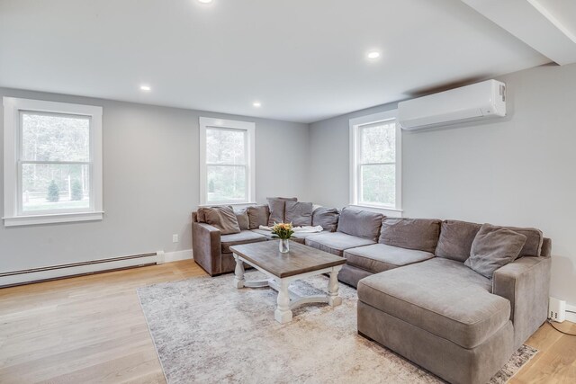 115 Kiahs Way E, Sandwich, MA 02537 - living room featuring a wall mounted air conditioner, a baseboard heating unit, light wood finished floors, and recessed lighting