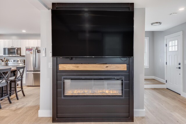 115 Kiahs Way E, Sandwich, MA 02537 - detailed view of stainless steel appliances, wood finished floors, baseboards, and recessed lighting