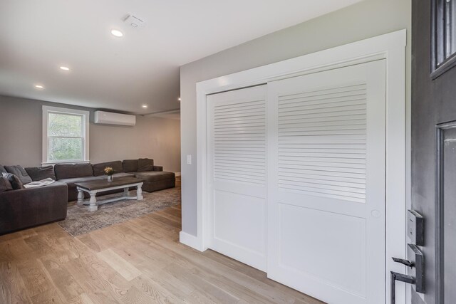 115 Kiahs Way E, Sandwich, MA 02537 - living area featuring a wall mounted air conditioner, light wood-style flooring, and recessed lighting