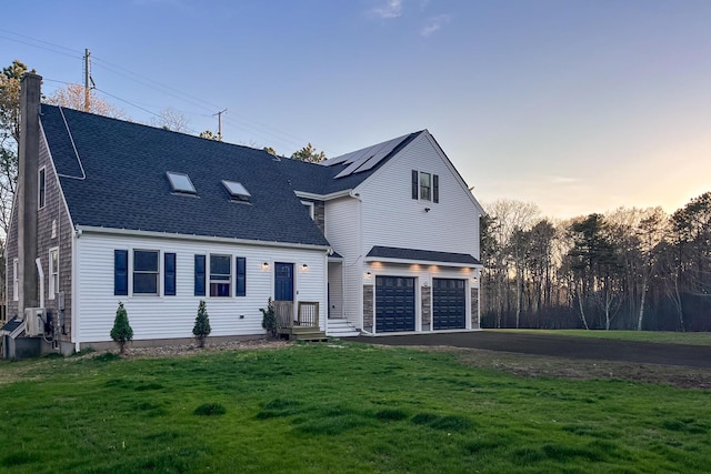115 Kiahs Way E, Sandwich, MA 02537 - view of front of house with driveway, a front lawn, a garage, a chimney, and roof with shingles