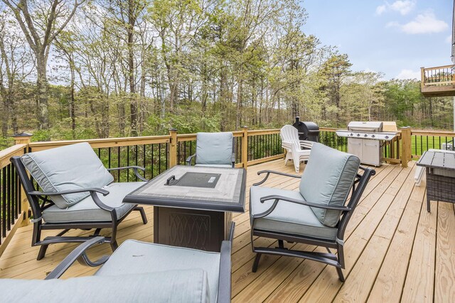 115 Kiahs Way E, Sandwich, MA 02537 - deck with a grill, a fire pit, and a wooded view