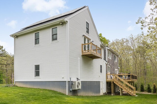 115 Kiahs Way E, Sandwich, MA 02537 - view of side of home featuring a balcony, stairway, ac unit, a yard, and a deck