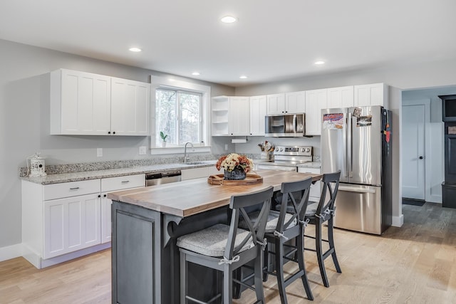 115 Kiahs Way E, Sandwich, MA 02537 - kitchen featuring appliances with stainless steel finishes, a sink, white cabinets, and recessed lighting