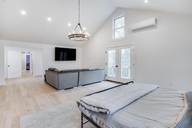 115 Kiahs Way E, Sandwich, MA 02537 - bedroom with a wall unit AC, high vaulted ceiling, access to outside, french doors, and a chandelier