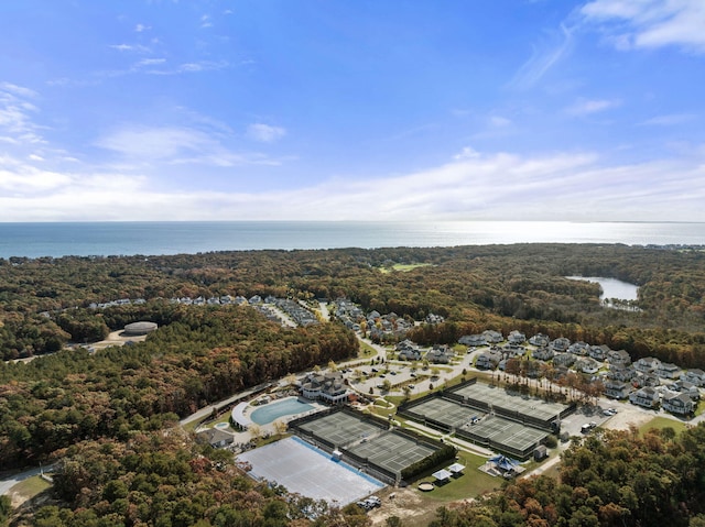 bird's eye view with a water view and a forest view