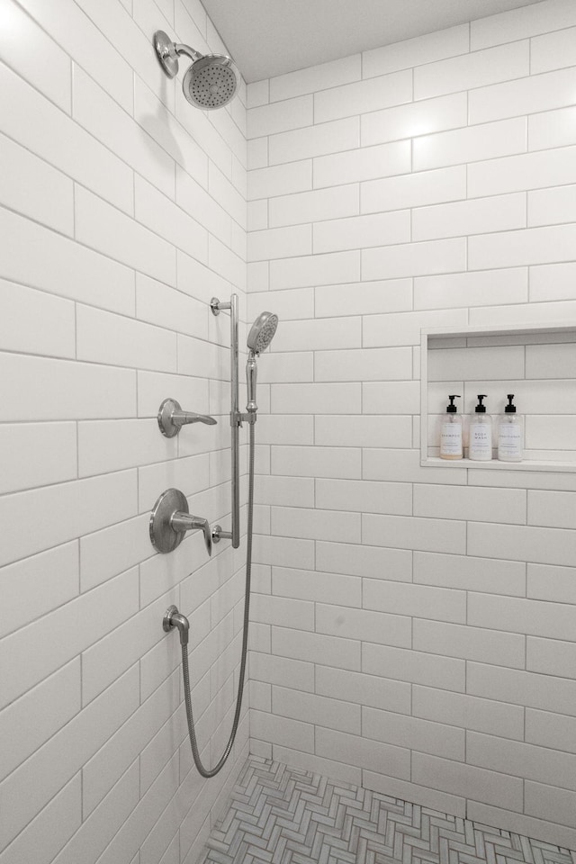 bathroom with tiled shower