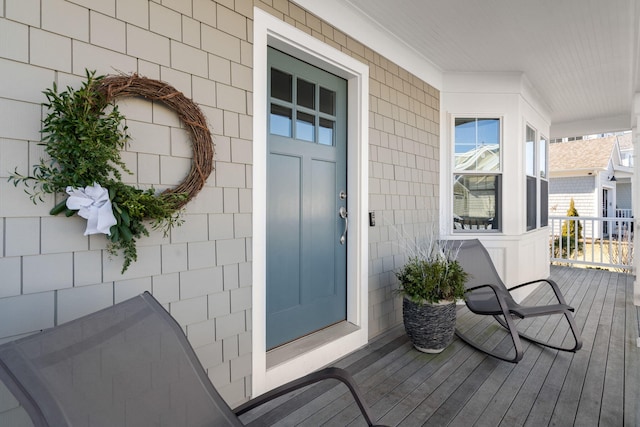 doorway to property featuring covered porch