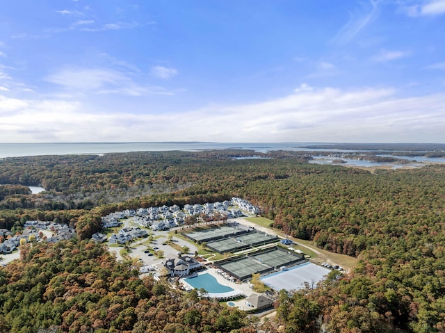 bird's eye view with a water view and a view of trees