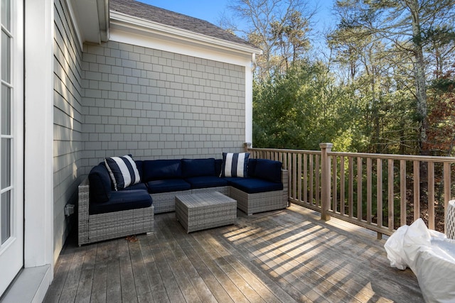 wooden terrace featuring an outdoor hangout area