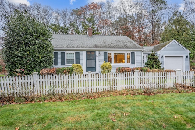 ranch-style home with a garage and a front yard