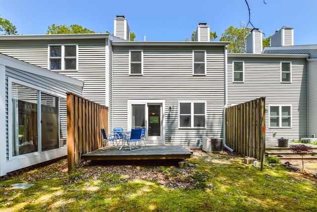 34 Southpoint Dr, Sandwich, MA 02563 - back of house featuring a wooden deck, central air condition unit, and a chimney