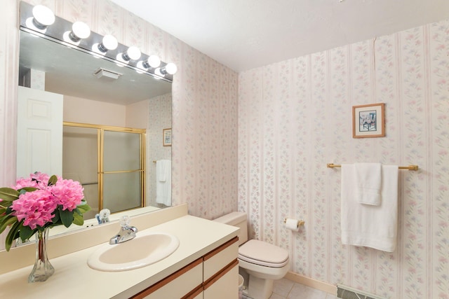 34 Southpoint Dr, Sandwich, MA 02563 - full bath with tile patterned floors, vanity, a shower with door, and toilet