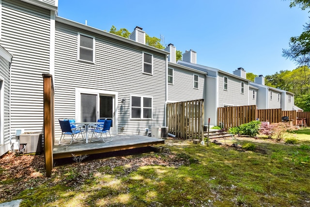 34 Southpoint Dr, Sandwich, MA 02563 - back of house with a chimney, a deck, and cooling unit