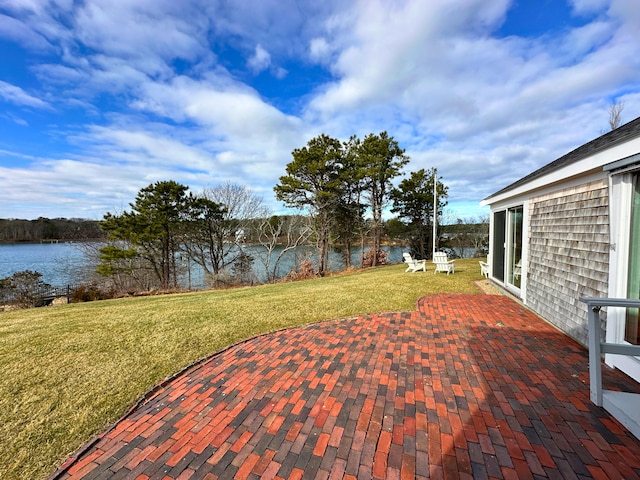 view of patio featuring a water view