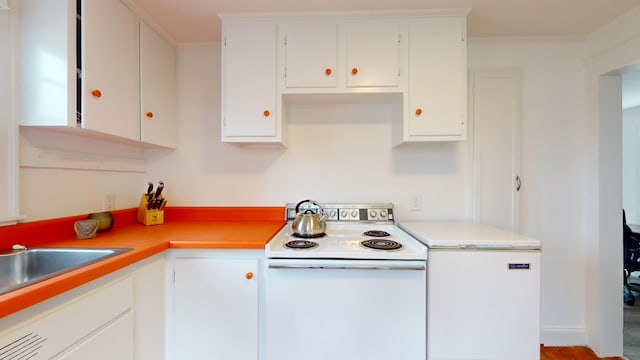 kitchen featuring white cabinets and white electric range