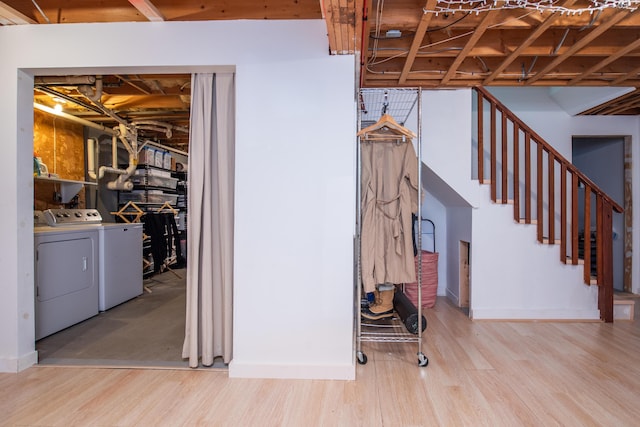 10 Bay View Rd, Wellfleet, MA 02667 - below grade area featuring washer and dryer, stairway, and wood finished floors