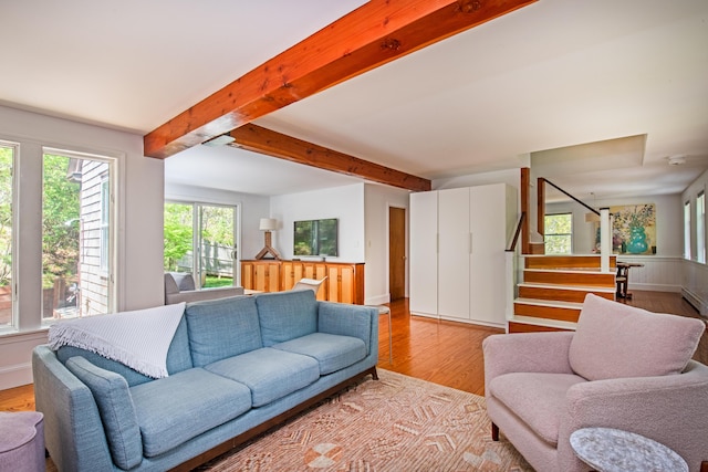10 Bay View Rd, Wellfleet, MA 02667 - living area with beamed ceiling, light wood-type flooring, stairs, and a baseboard heating unit