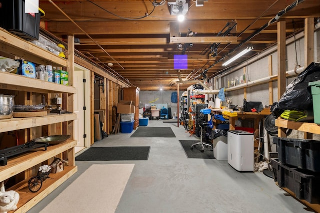 unfinished basement with a workshop area